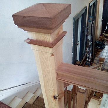 Handmade newel post on stairs